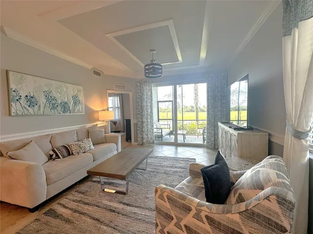 a living room with furniture rug and window