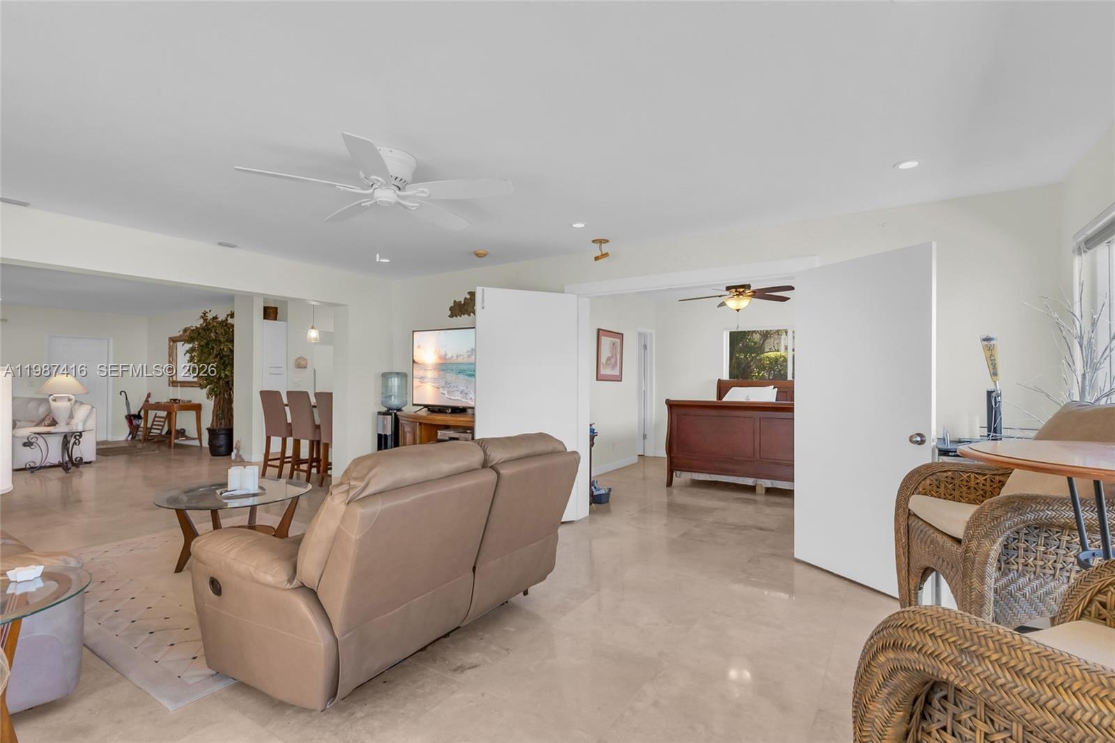 1995 Ixora Road North Miami, FL 33181 - Photo 17 of 30 a living room with furniture and a couch