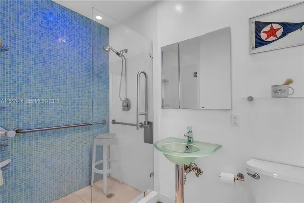 a bathroom with a sink and a shower