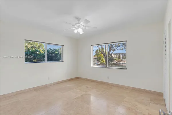a view of an empty room with a window