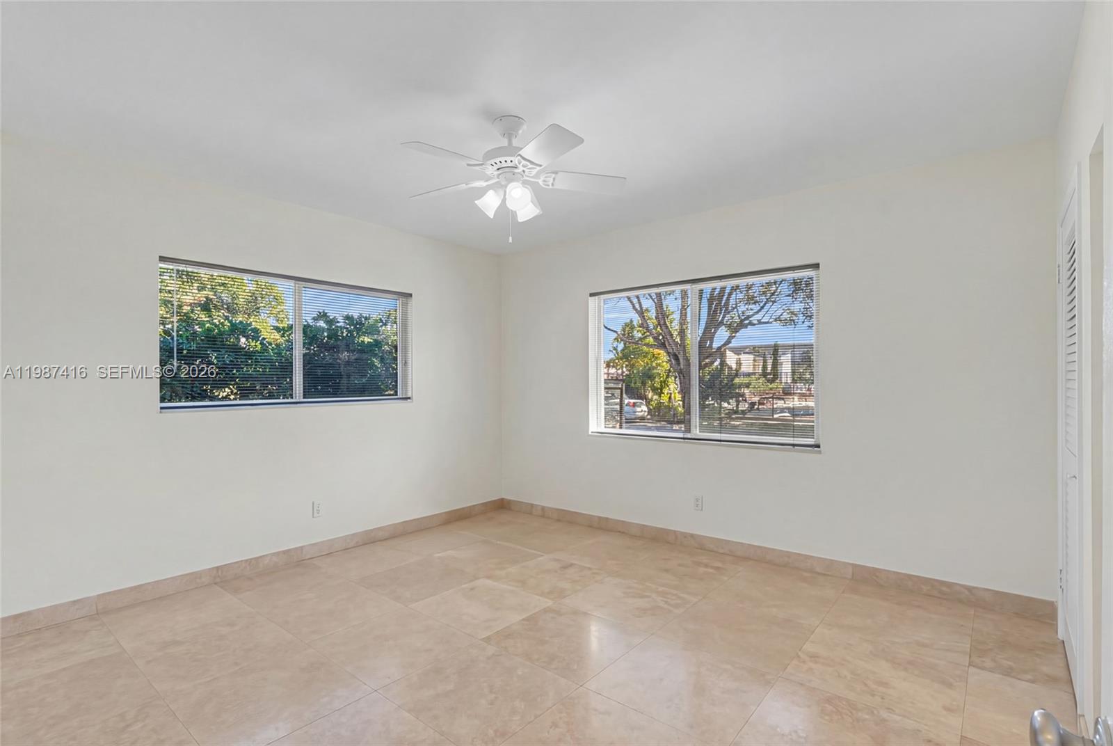 1995 Ixora Road North Miami, FL 33181 - Photo 20 of 30 a view of an empty room with a window