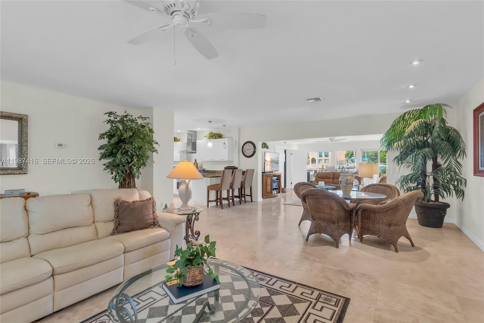 1995 Ixora Road North Miami, FL 33181 - Photo 2 of 30 a living room with furniture and a chandelier