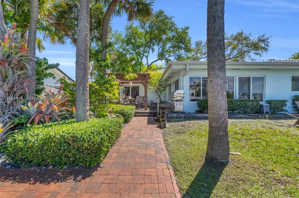 a view of a house with fountain bath tub and trees