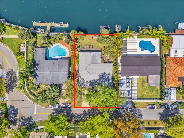 an aerial view of houses with outdoor space