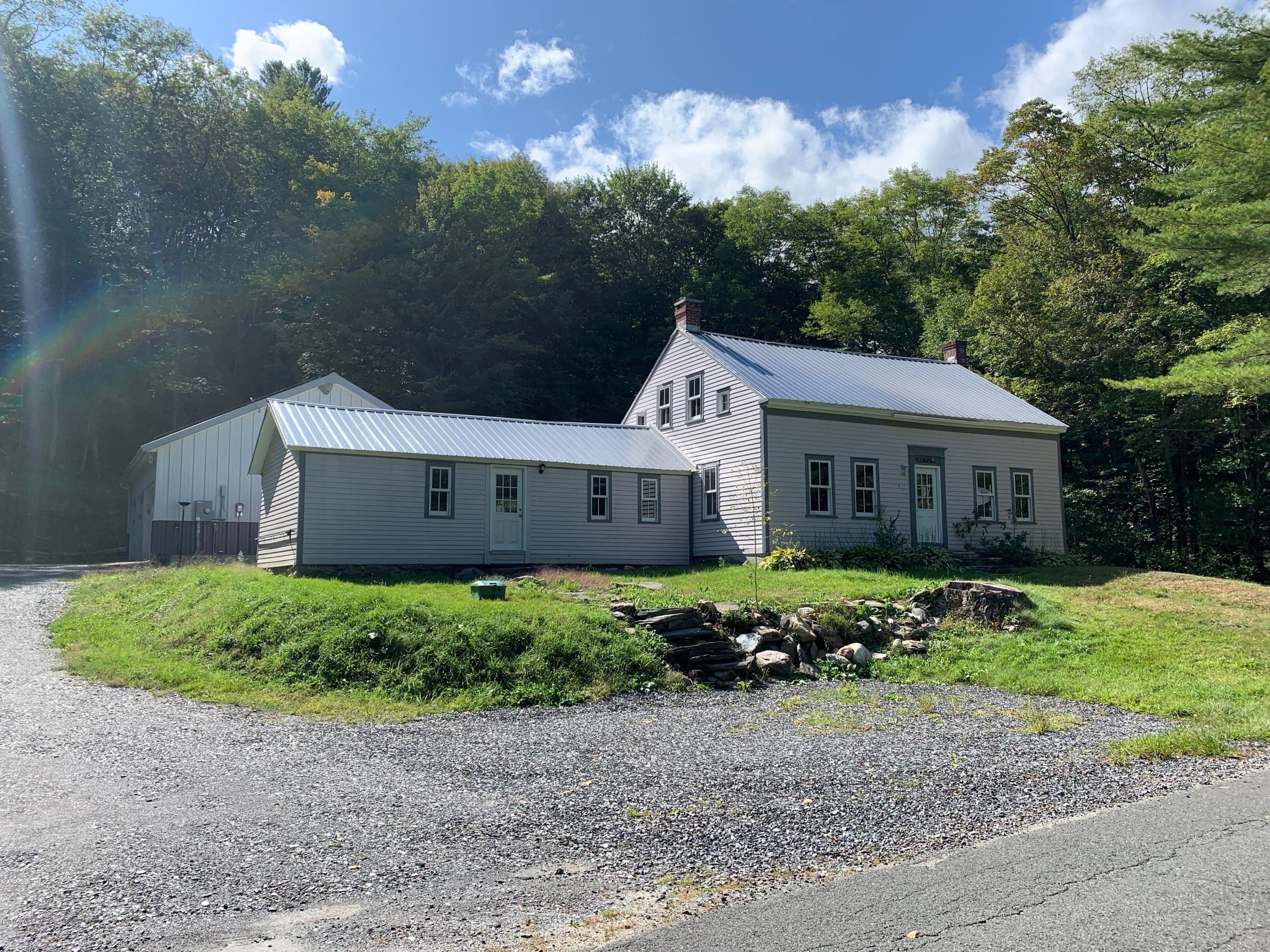471 River Road Windsor, MA 01270 - Photo 1 of 19 a view of a house with a yard and large trees