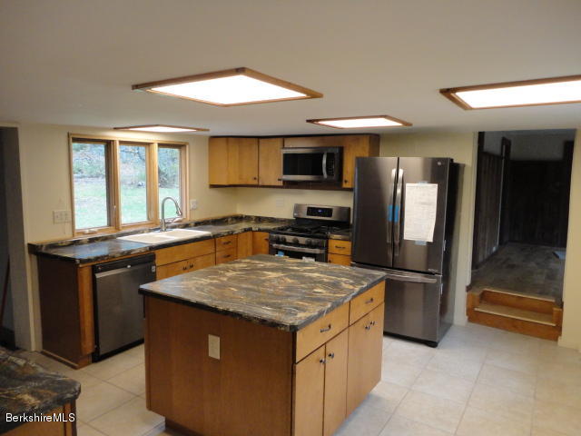 471 River Road Windsor, MA 01270 - Photo 2 of 19 a kitchen with stainless steel appliances granite countertop a sink and a refrigerator