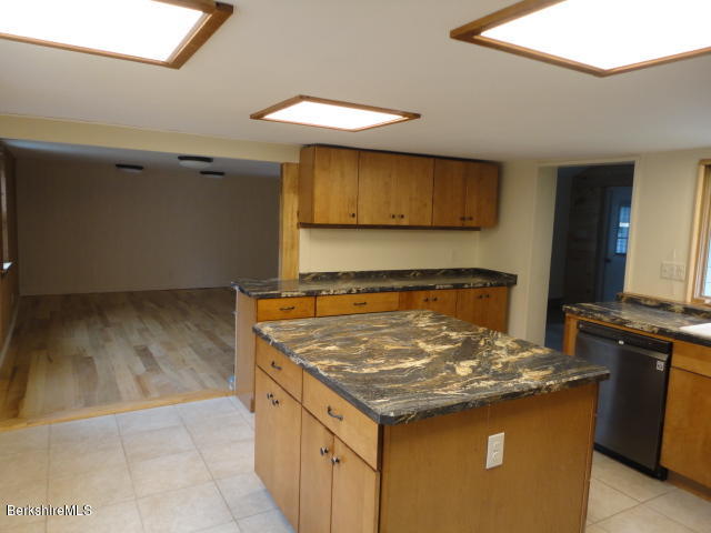 471 River Road Windsor, MA 01270 - Photo 3 of 19 a kitchen with a stove and a refrigerator