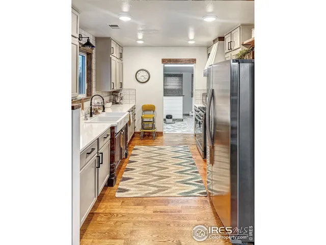 a bathroom with a sink a mirror and shower