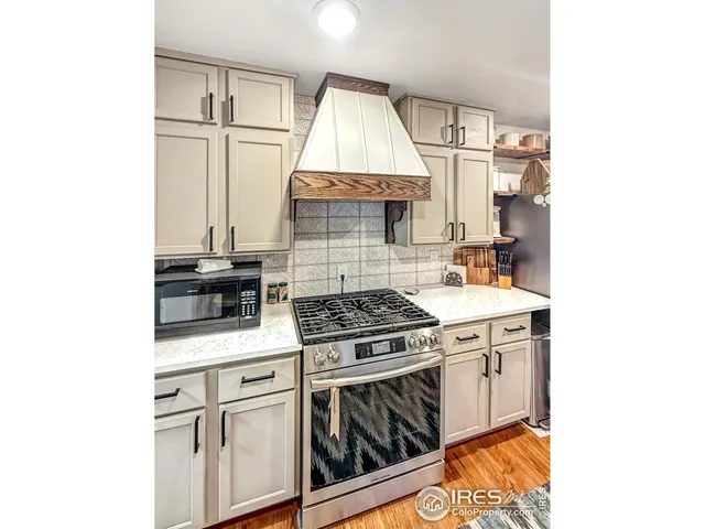 a kitchen with a stove and a microwave