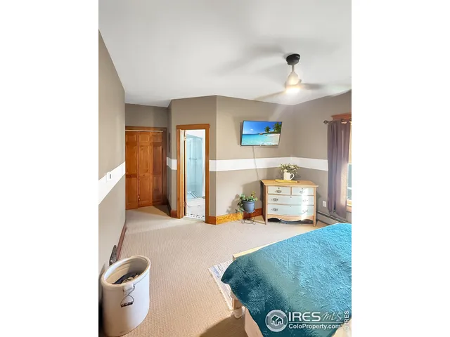a view of walk in closet with bathroom