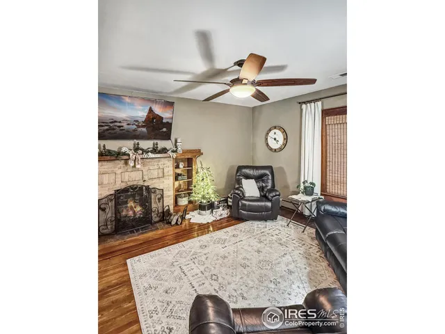 a living room with furniture and flat screen tv
