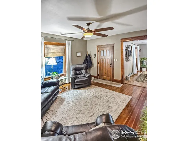 a living room with furniture and a rug