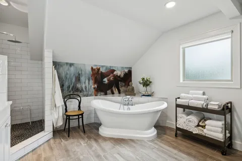 a spacious bathroom with a sink and a mirror