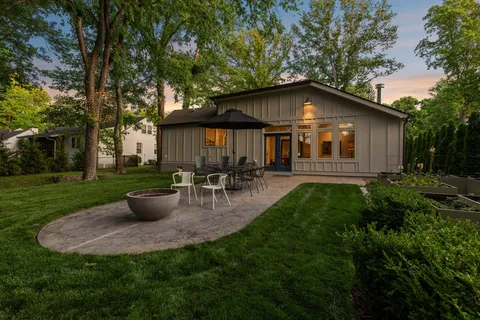 a front view of house with yard and green space