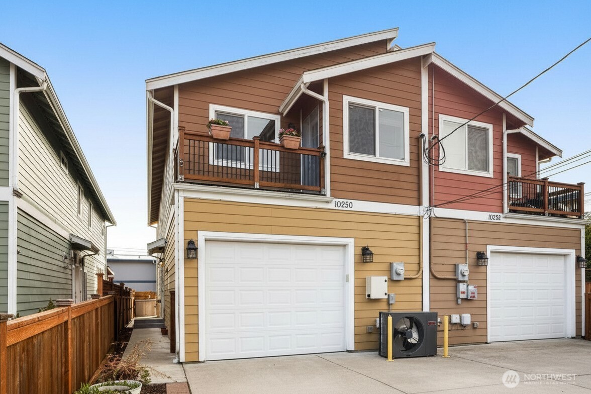 a front view of a house with garage