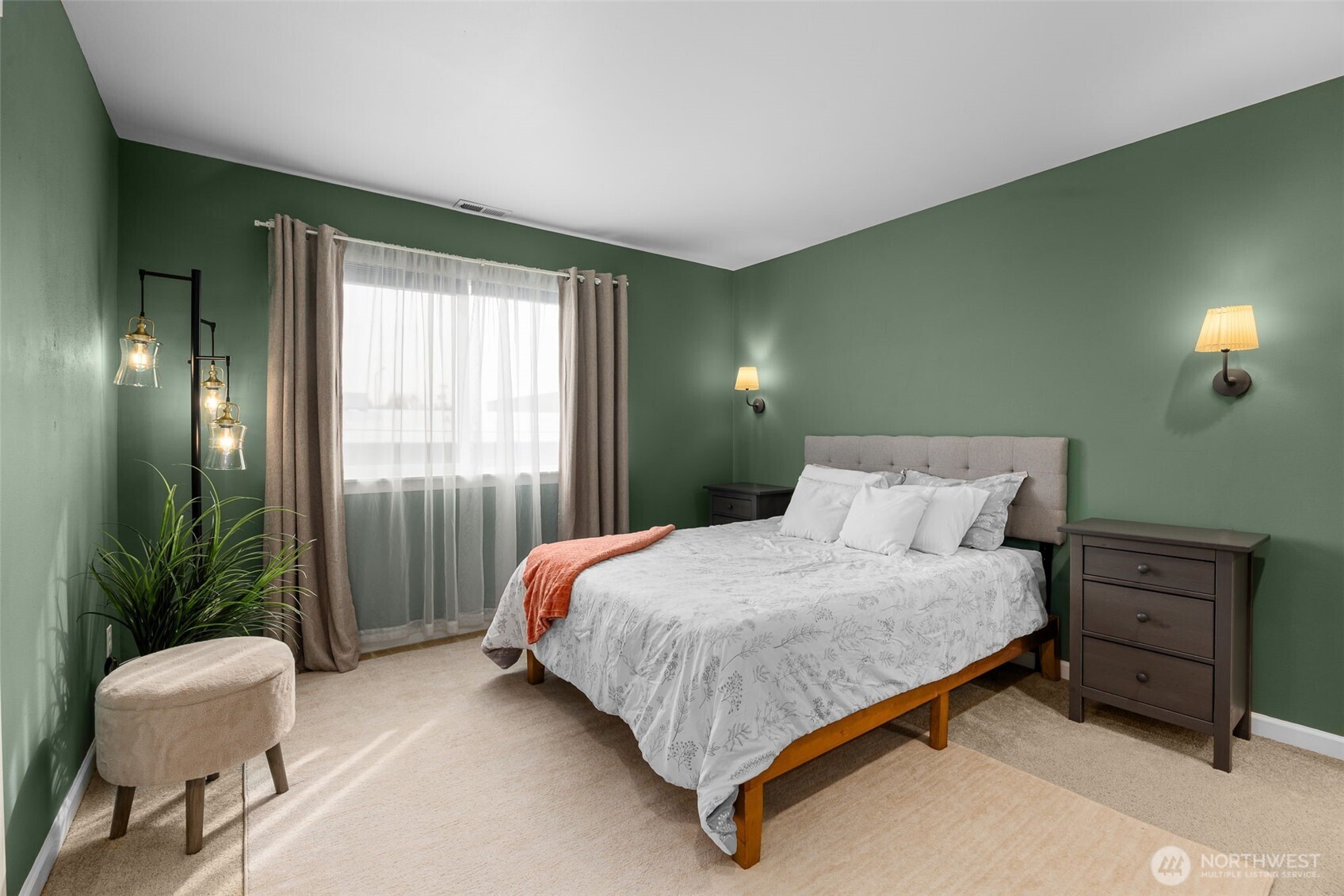 10250 17th Avenue Southwest Seattle, WA 98146 - Photo 13 of 23 a bedroom with a bed and a chair