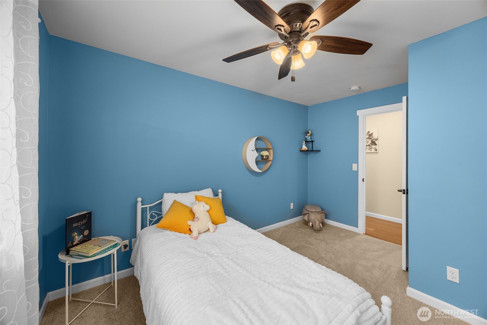 10250 17th Avenue Southwest Seattle, WA 98146 - Photo 17 of 23 a bedroom with a bed and a chandelier