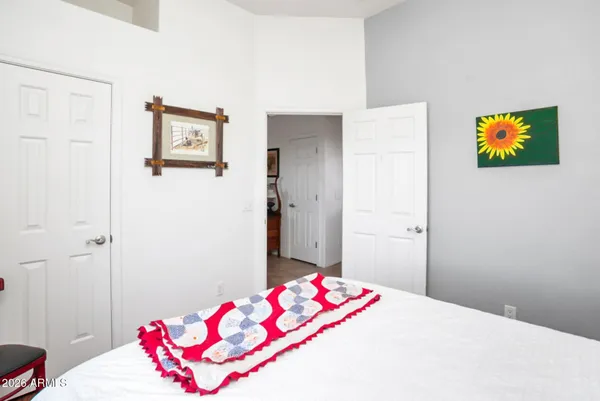 a bedroom with a bed and a dresser