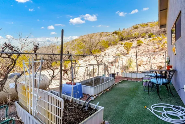a view of an chairs and tables in the patio