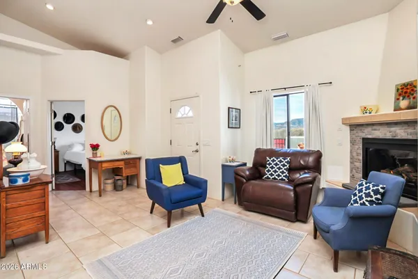 a living room with furniture a rug and a fireplace
