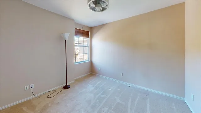 a view of an empty room and window