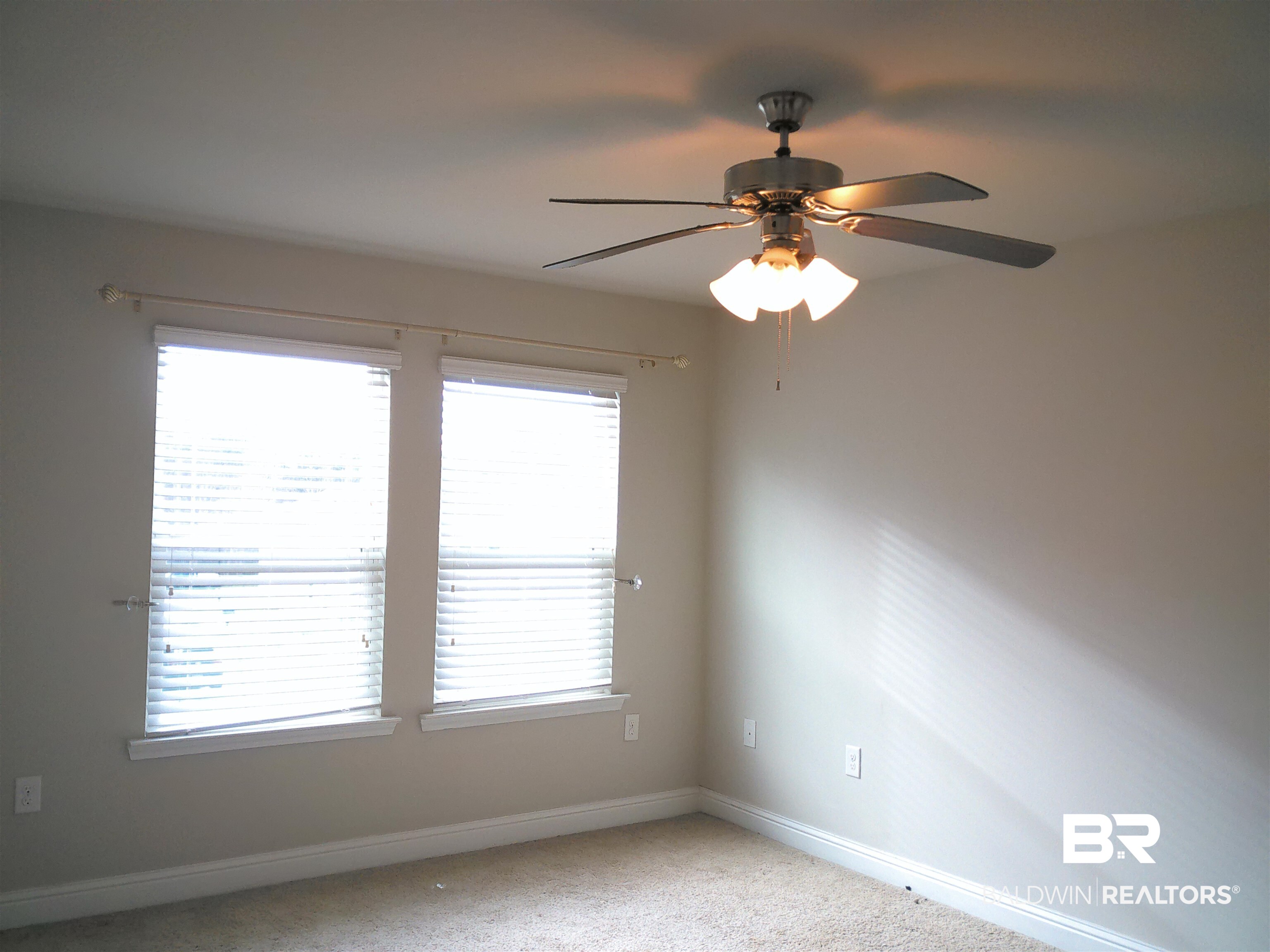 25806 Pollard Road, Unit 23 Daphne, AL 36526 - Photo 8 of 16 Unfurnished room featuring ceiling fan and light carpet