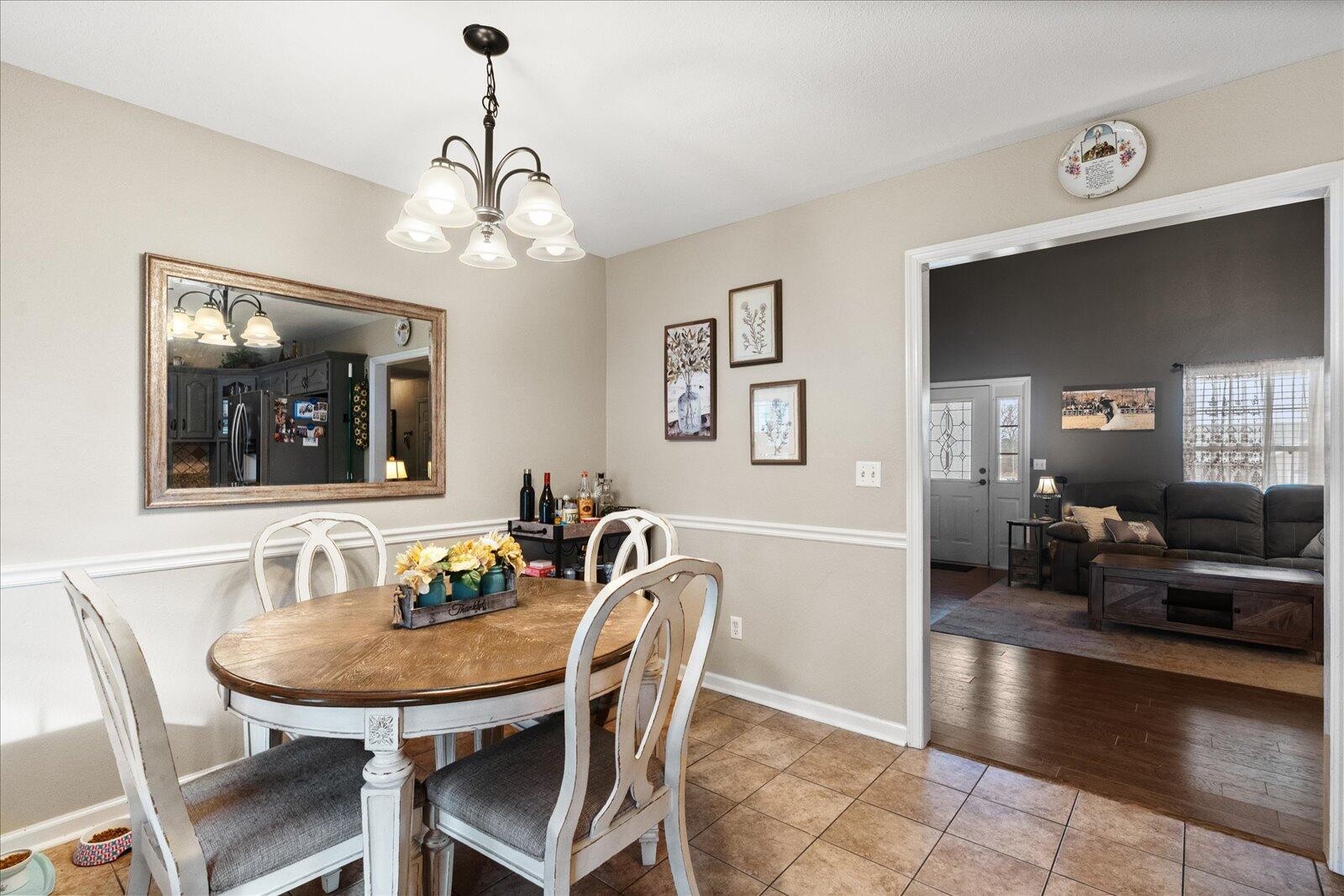 792 Colony Circle Fort Oglethorpe, GA 30742 - Photo 11 of 36 a view of a dining room with furniture and wooden floor