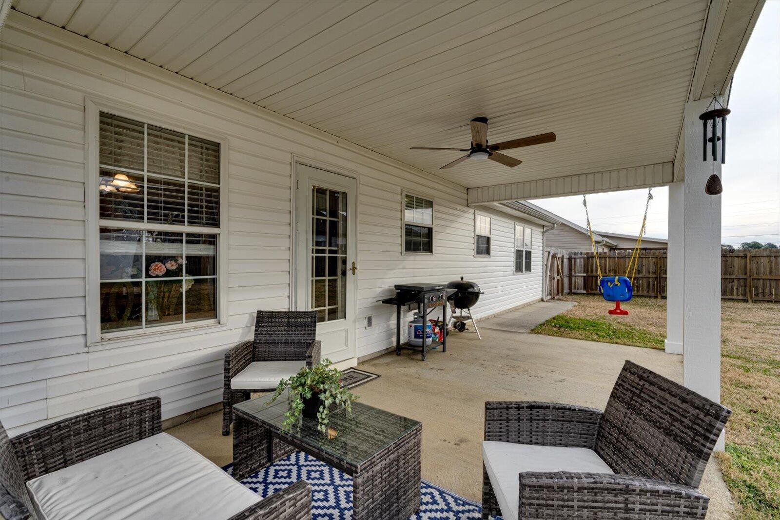 792 Colony Circle Fort Oglethorpe, GA 30742 - Photo 25 of 36 a view of a porch with chairs and a table