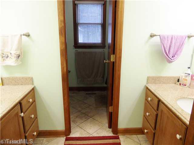7502 Alcorn Road Greensboro, NC 27409 - Photo 13 of 16 Master Bath/Spa. Take a look at the his and her vanities!