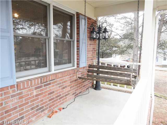 7502 Alcorn Road Greensboro, NC 27409 - Photo 14 of 16 Exterior Front. The front rocking chair porch makes a great place to unwind!