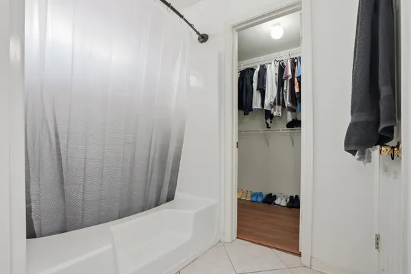 a bathroom with a tub and shower