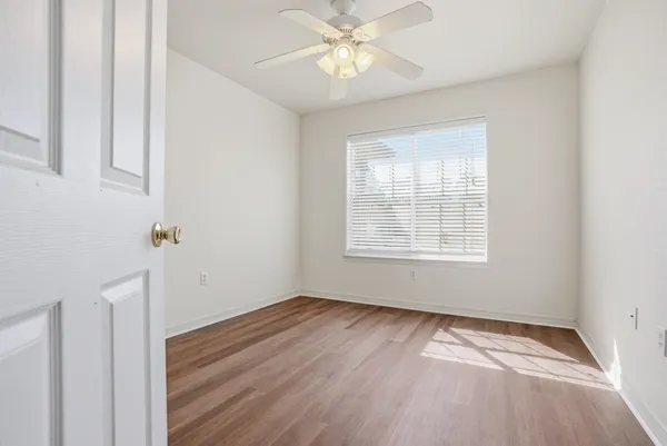 a view of an empty room with a window