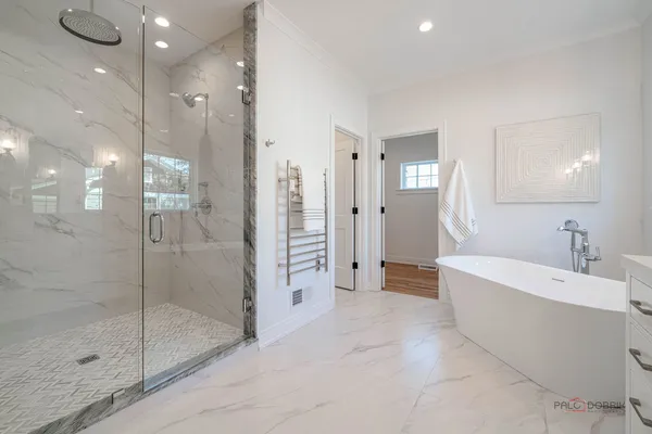 a spacious bathroom with a shower and a sink