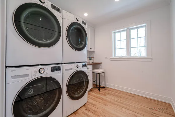 a view of a hallway with washer and dryer