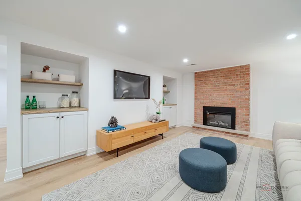 a living room with furniture and a fireplace