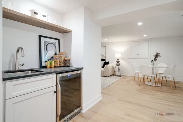 a spacious bathroom with a toilet a sink and mirror