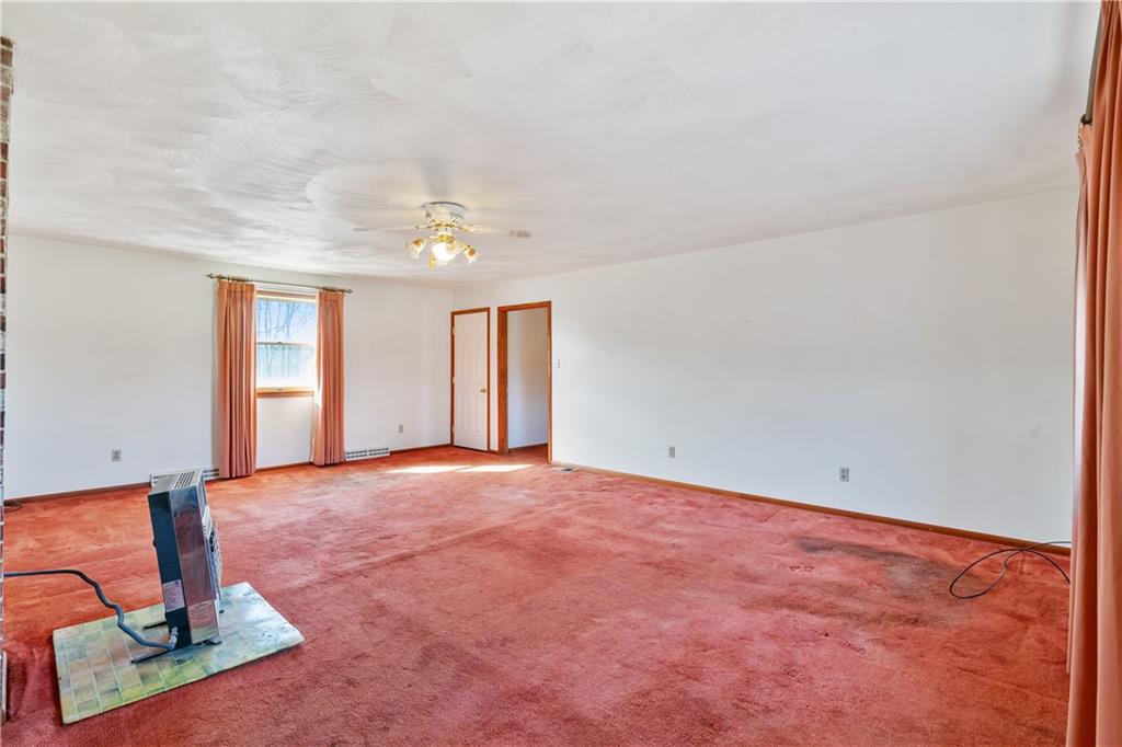 364 Spruce Hollow Road Vandergrift, PA 15690 - Photo 19 of 37 an empty room with windows and ceiling fan
