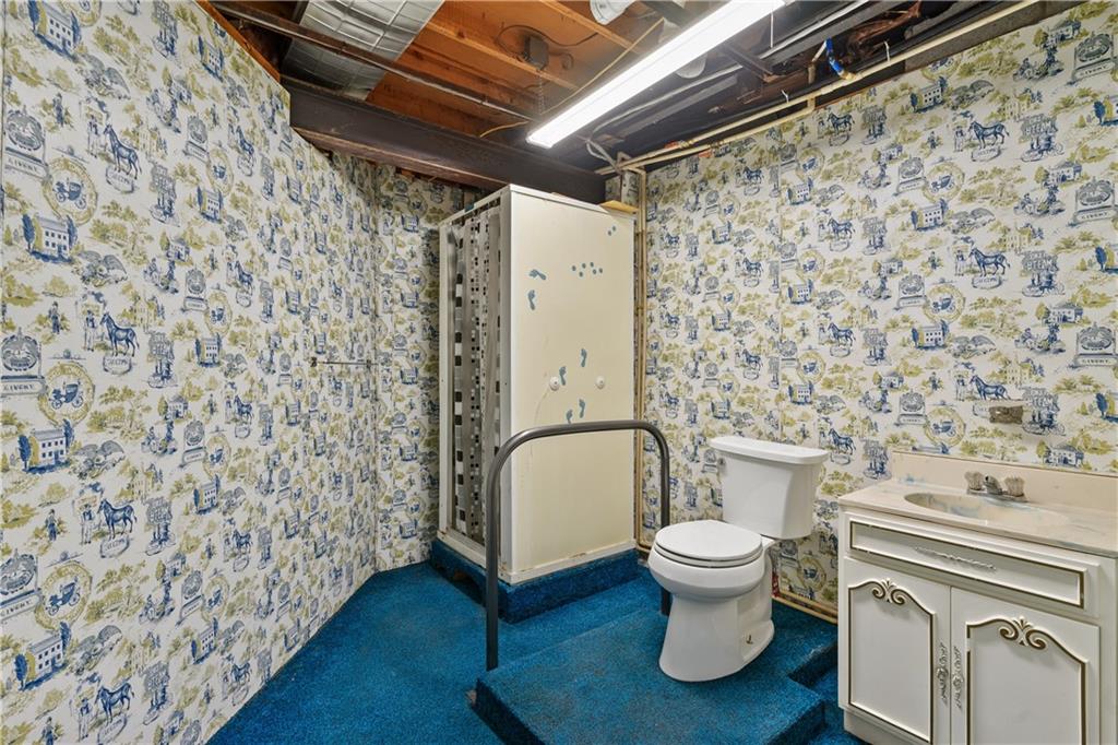 364 Spruce Hollow Road Vandergrift, PA 15690 - Photo 27 of 37 a bathroom with a toilet and a shower curtain