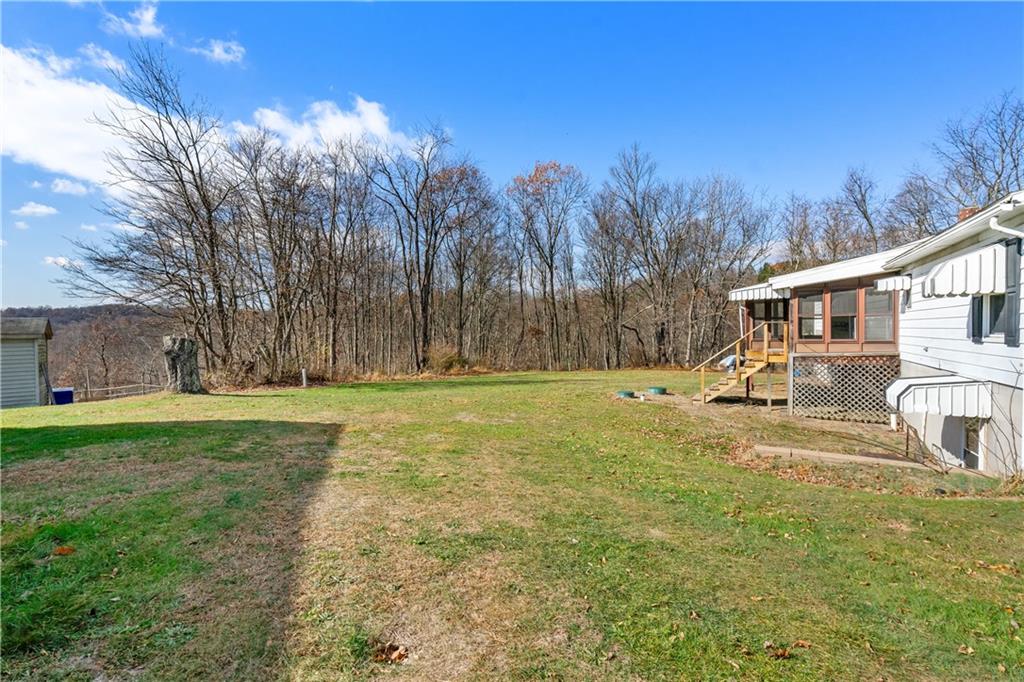 364 Spruce Hollow Road Vandergrift, PA 15690 - Photo 33 of 37 a view of a house with a yard