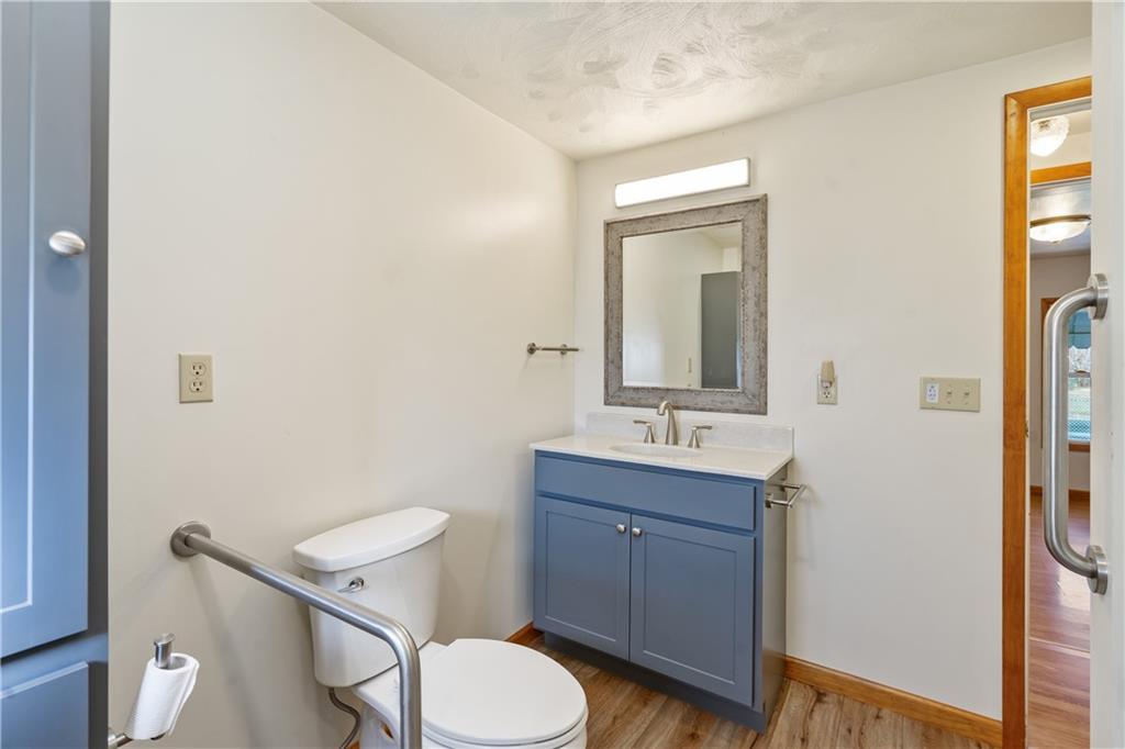 364 Spruce Hollow Road Vandergrift, PA 15690 - Photo 8 of 37 a bathroom with a toilet a sink and mirror