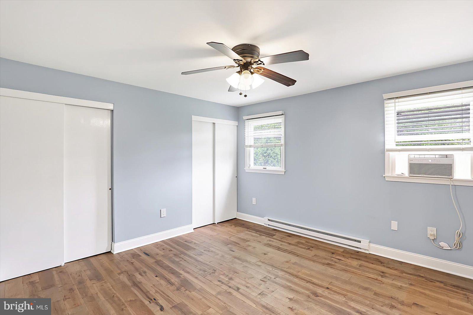 5824 Spruce Road Felton, PA 17322 - Photo 12 of 38 a view of an empty room with wooden floor and a window