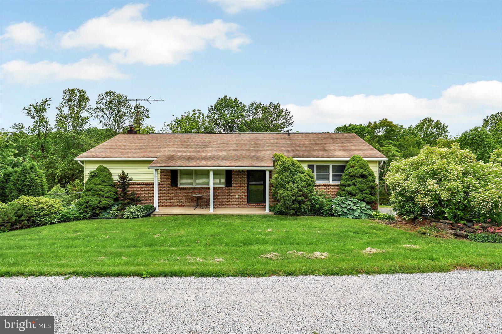 5824 Spruce Road Felton, PA 17322 - Photo 2 of 38 a view of a house with a yard and potted plants