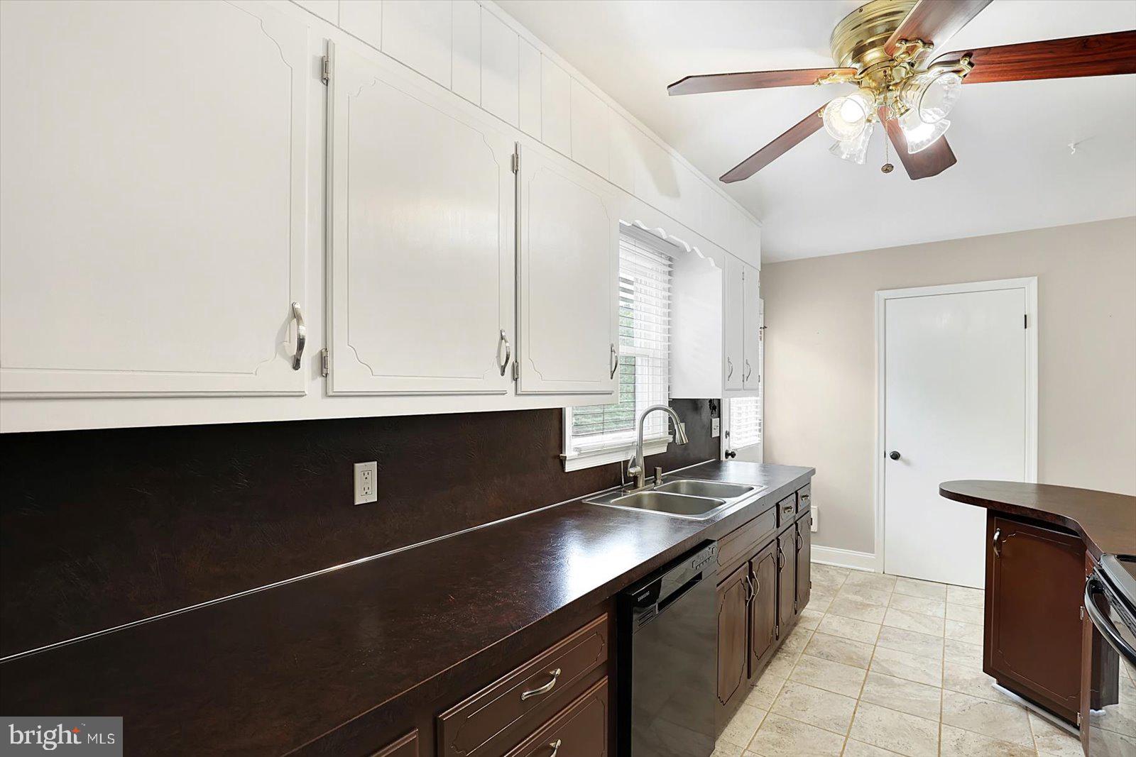5824 Spruce Road Felton, PA 17322 - Photo 4 of 38 a kitchen with stainless steel appliances granite countertop a sink a stove and a microwave