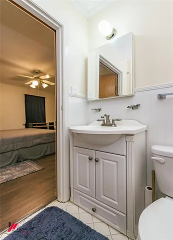 a bathroom with a sink vanity and mirror