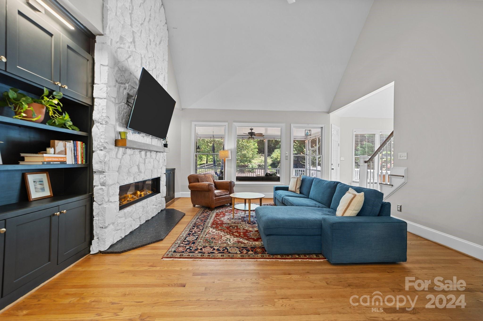 251 Kimberly Road Davidson, NC 28036 - Photo 12 of 47 a living room with fireplace furniture and a flat screen tv