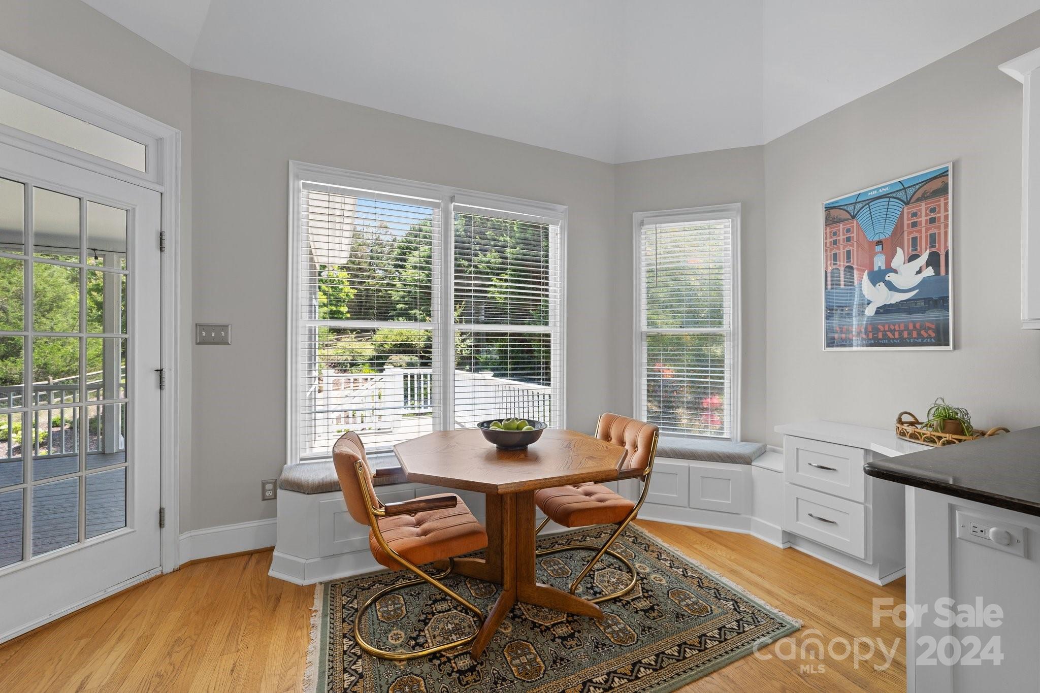 251 Kimberly Road Davidson, NC 28036 - Photo 15 of 47 a dining room with furniture and wooden floor