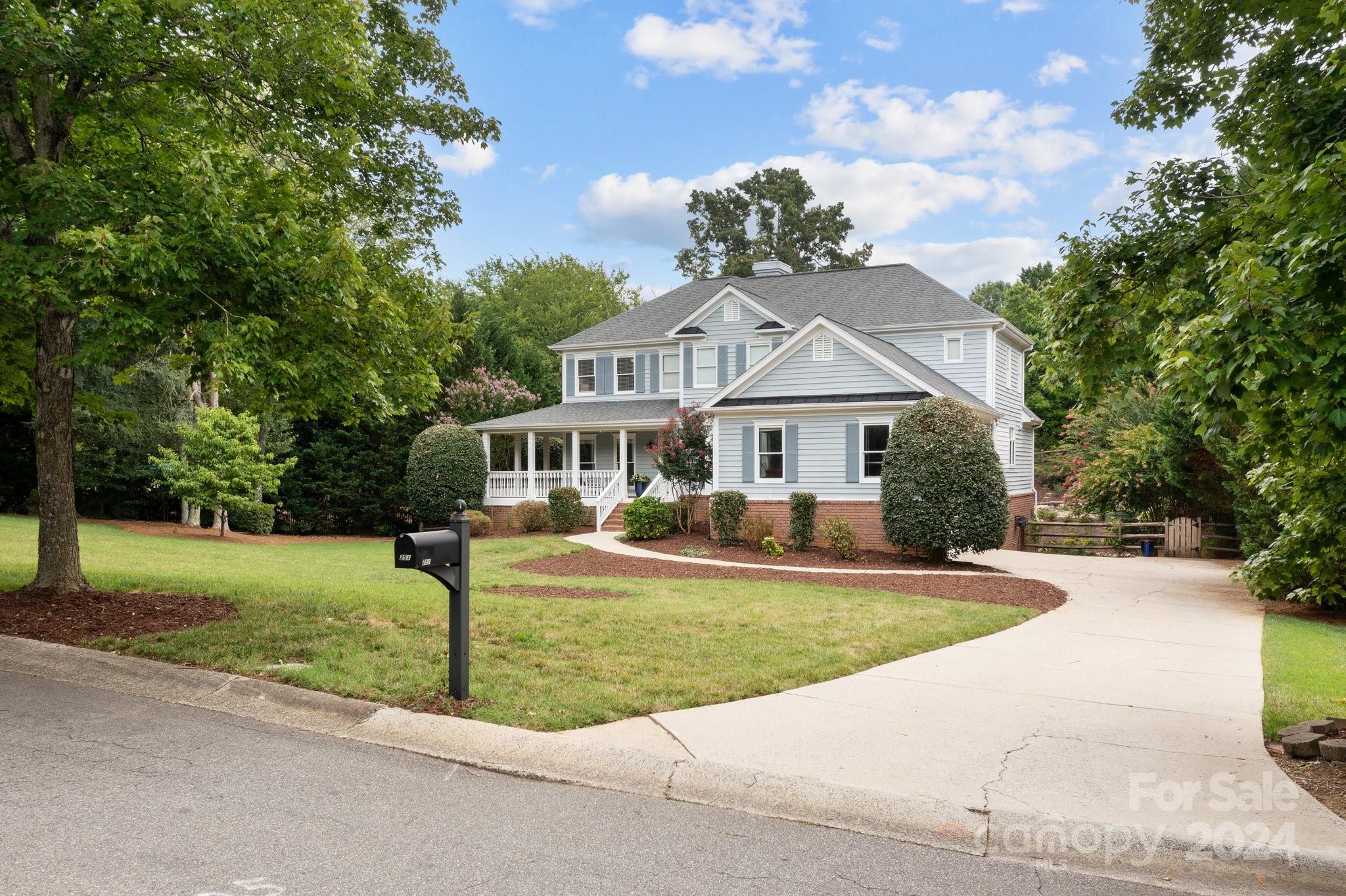 251 Kimberly Road Davidson, NC 28036 - Photo 2 of 47 a front view of a house with a yard and porch