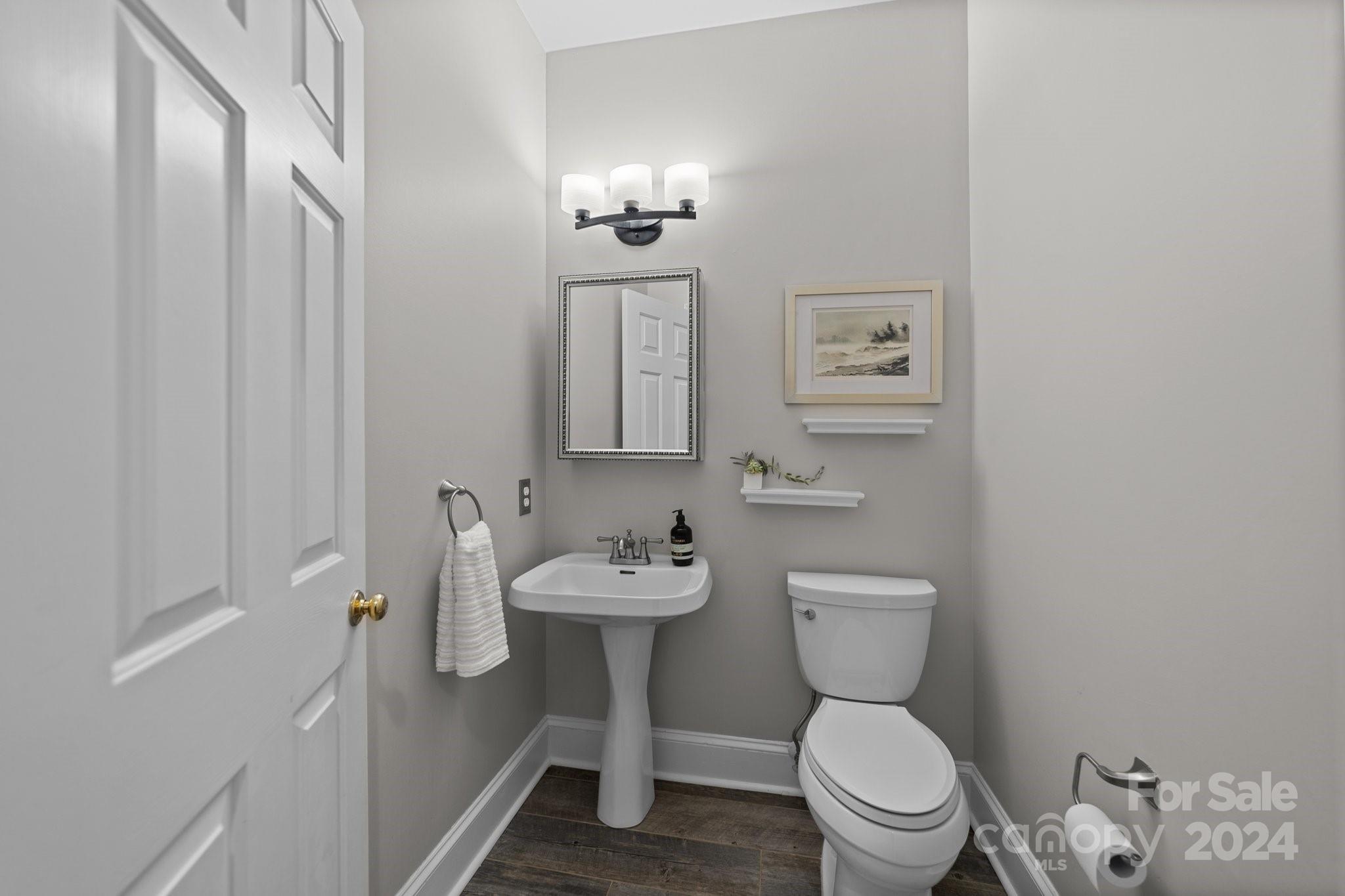 251 Kimberly Road Davidson, NC 28036 - Photo 21 of 47 a bathroom with a toilet sink and mirror