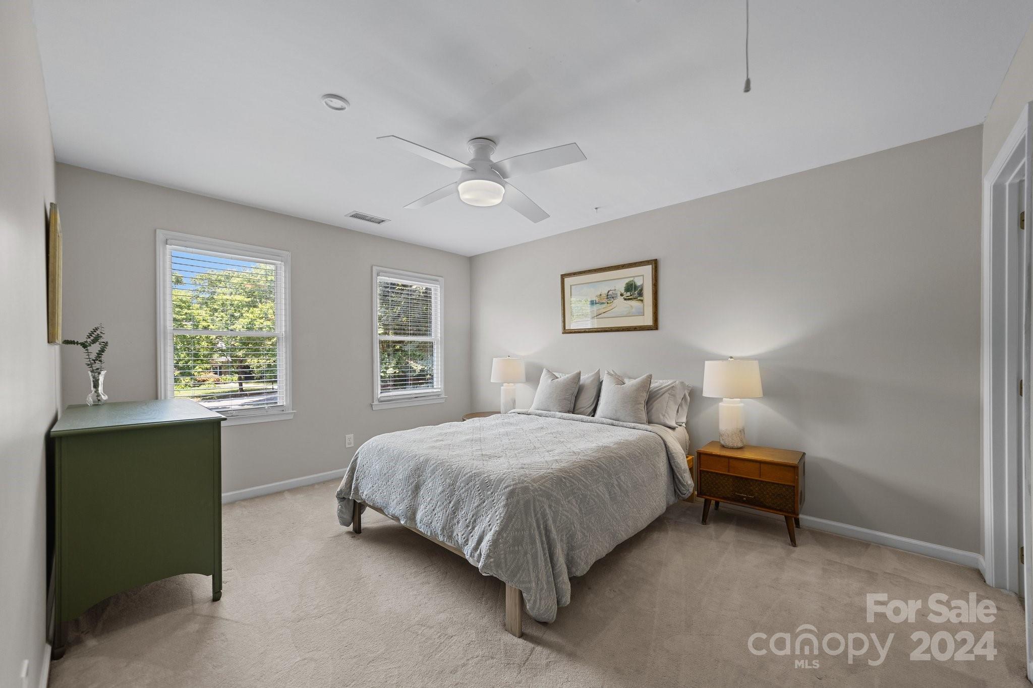 251 Kimberly Road Davidson, NC 28036 - Photo 29 of 47 a bedroom with a bed and a table in it