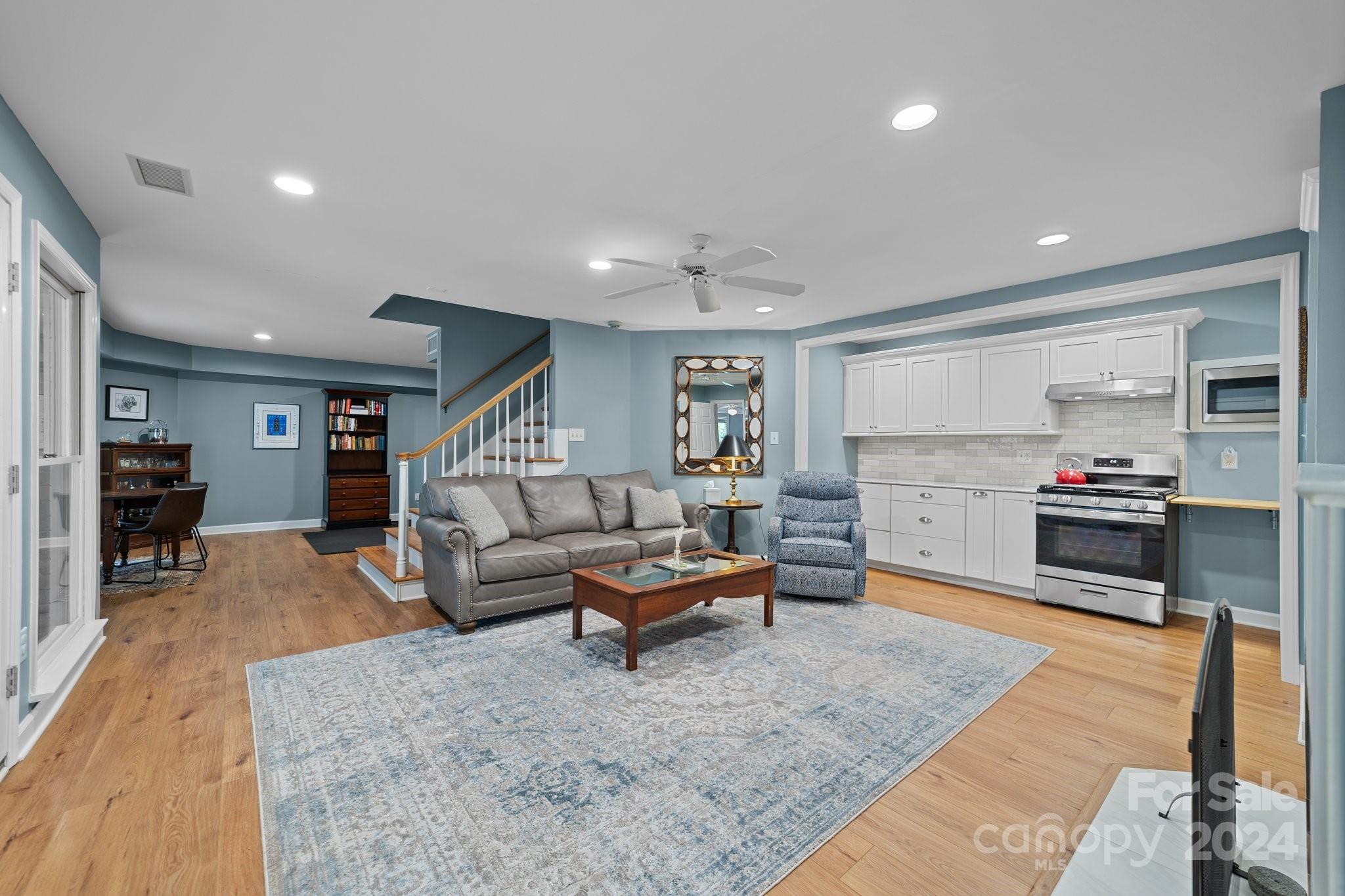251 Kimberly Road Davidson, NC 28036 - Photo 34 of 47 a living room with furniture and kitchen view
